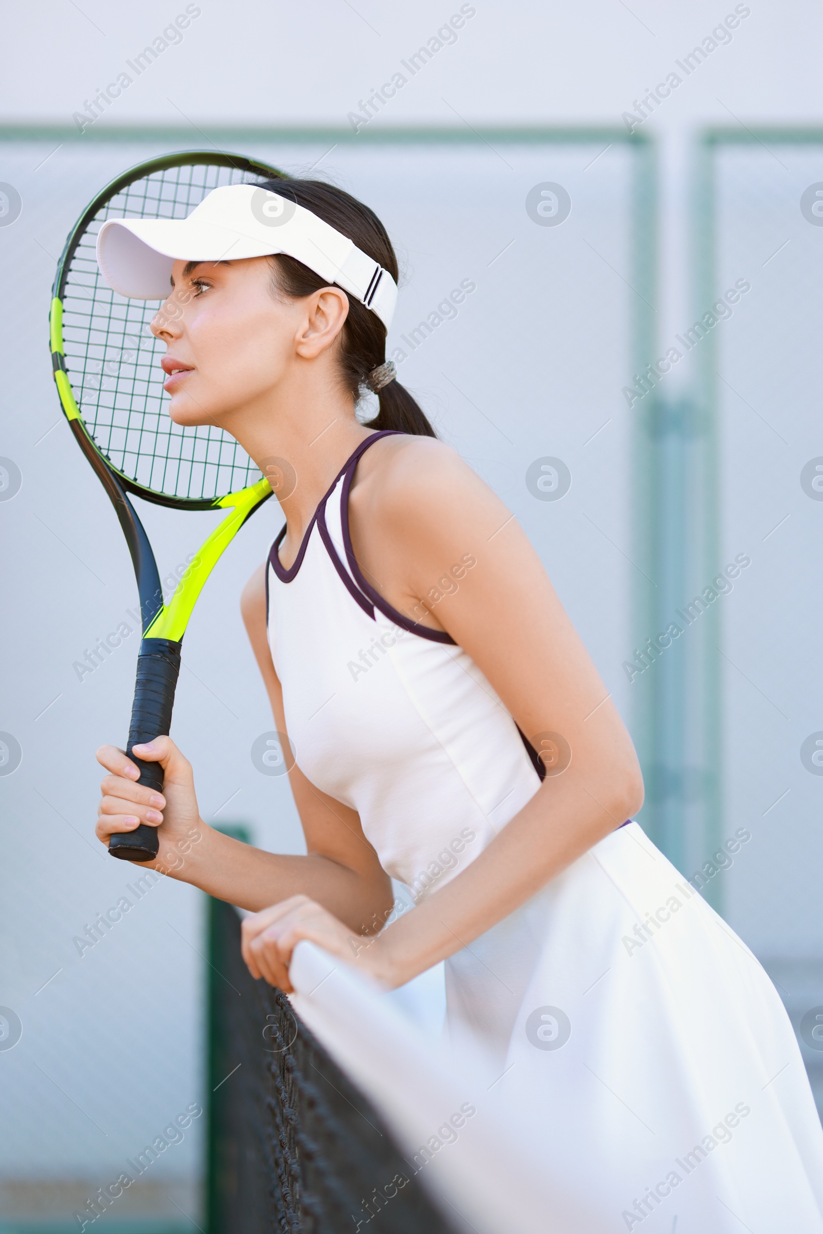 Photo of Beautiful woman with tennis racket on court