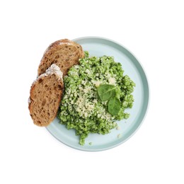 Photo of Tasty spinach risotto and bread isolated on white, top view