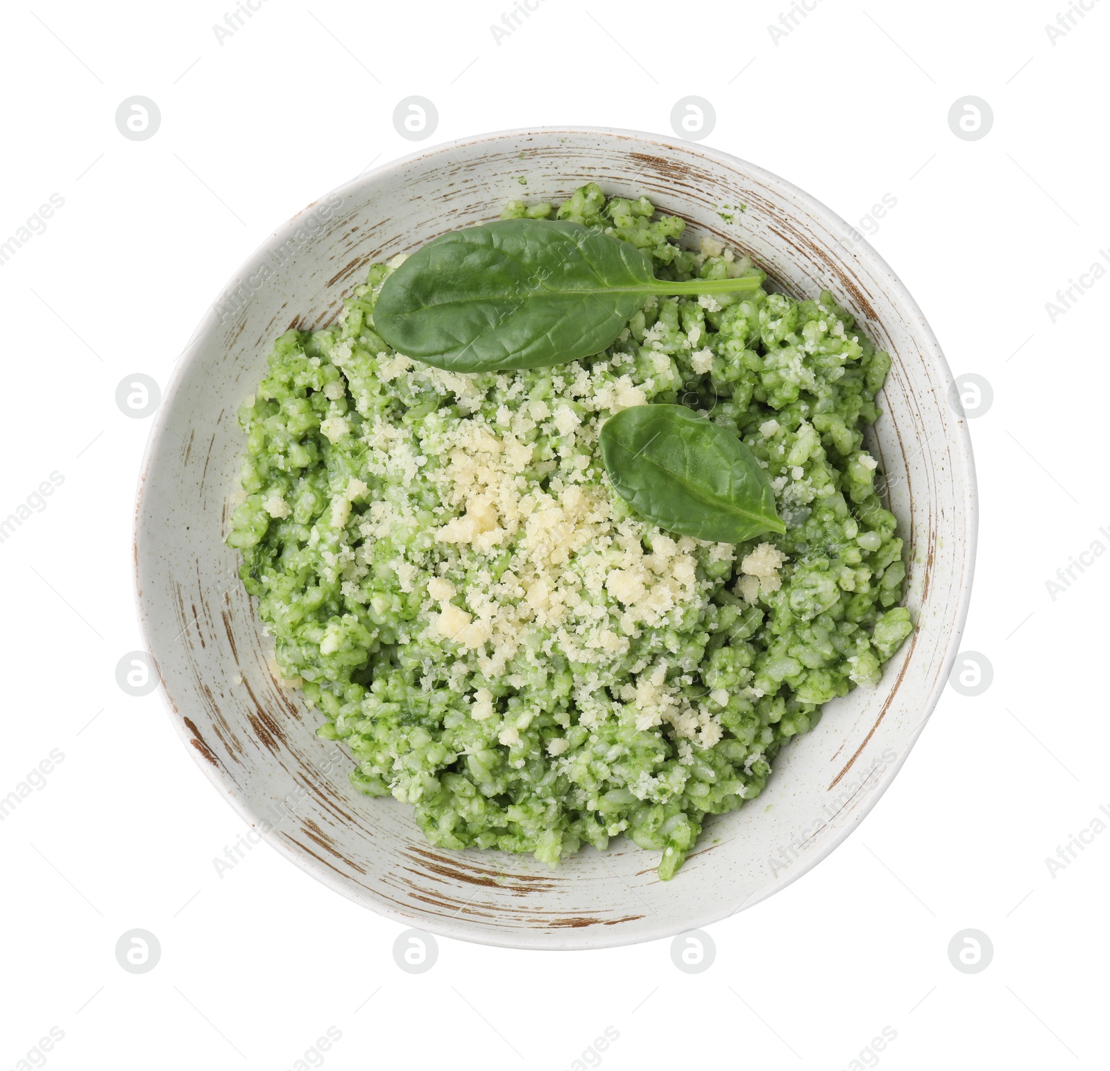 Photo of Tasty spinach risotto isolated on white, top view