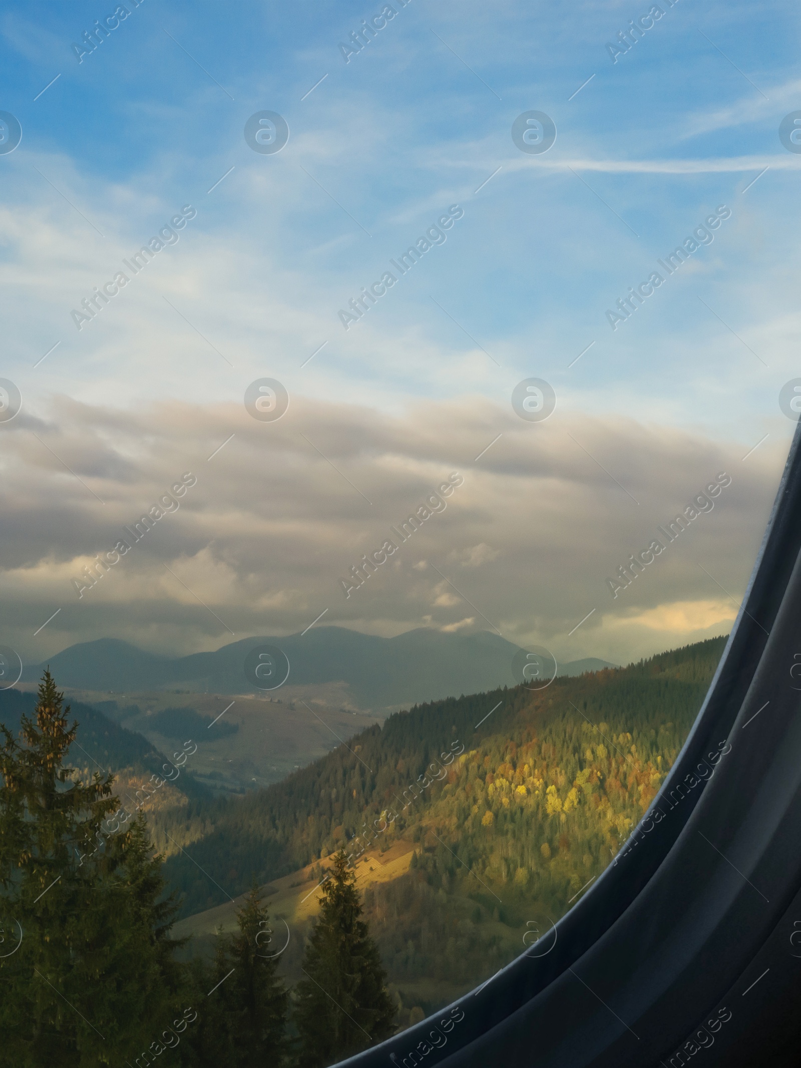 Image of Airplane taking off or landing, view on mountains from window