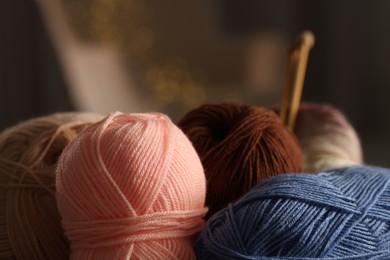 Knitting material. Skeins of soft yarn against blurred background, closeup