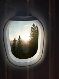 Image of Airplane taking off or landing, view on mountains from window