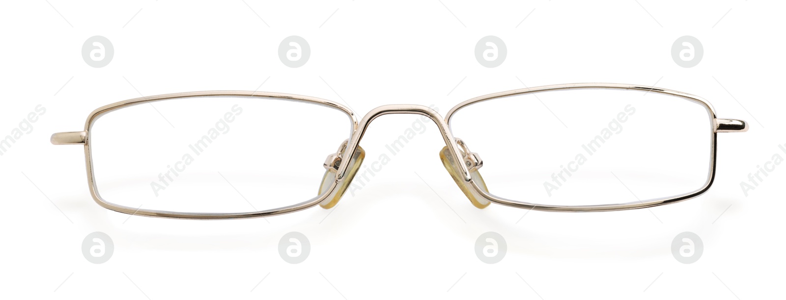 Image of Glasses with golden frame isolated on white