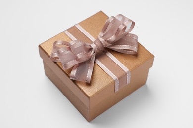 Photo of Gift box with bow on light grey background