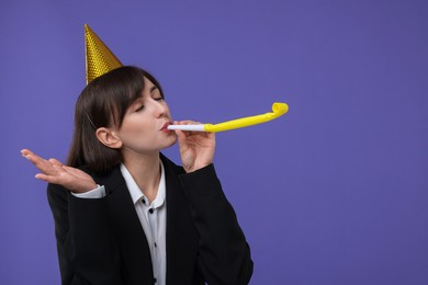 Woman in party hat with blower on purple background, space for text