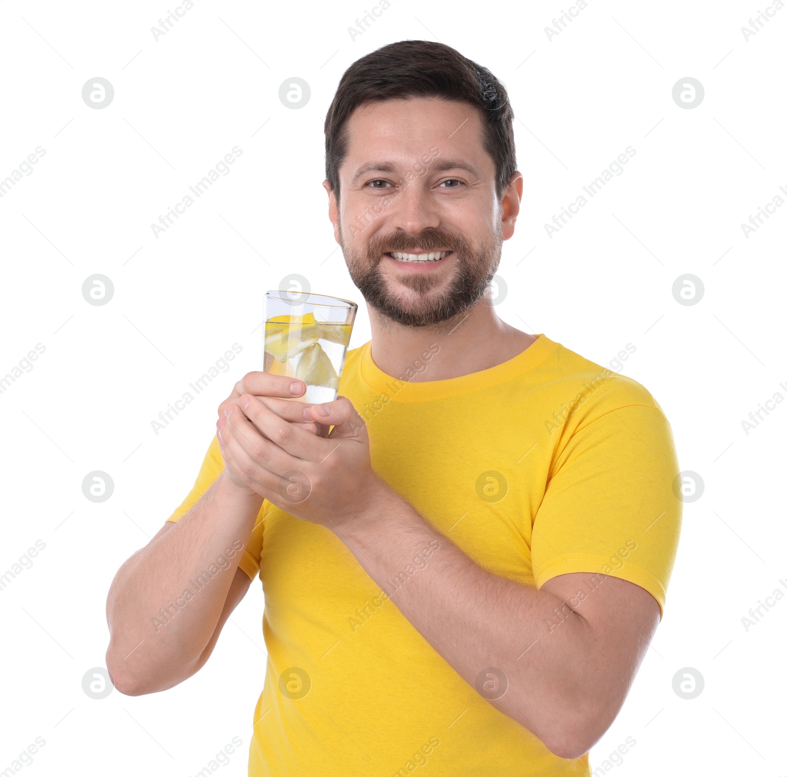 Photo of Happy man holding glass of water with lemon on white background