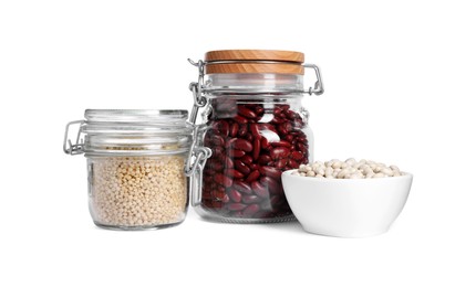 Photo of Different types of legumes and raw couscous in dishware isolated on white