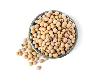 Soy beans in bowl isolated on white, top view