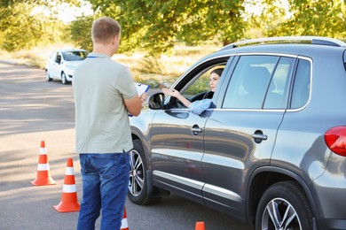 Photo of Woman passing maneuverability driving test on track