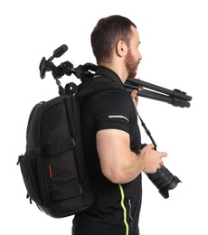 Photographer with backpack, tripod and camera on white background