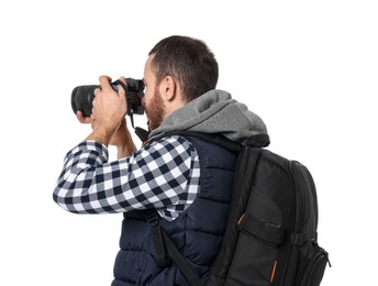 Photographer with backpack and camera taking picture on white background, back view