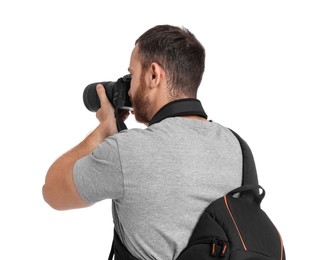 Photographer with backpack and camera taking picture on white background, back view