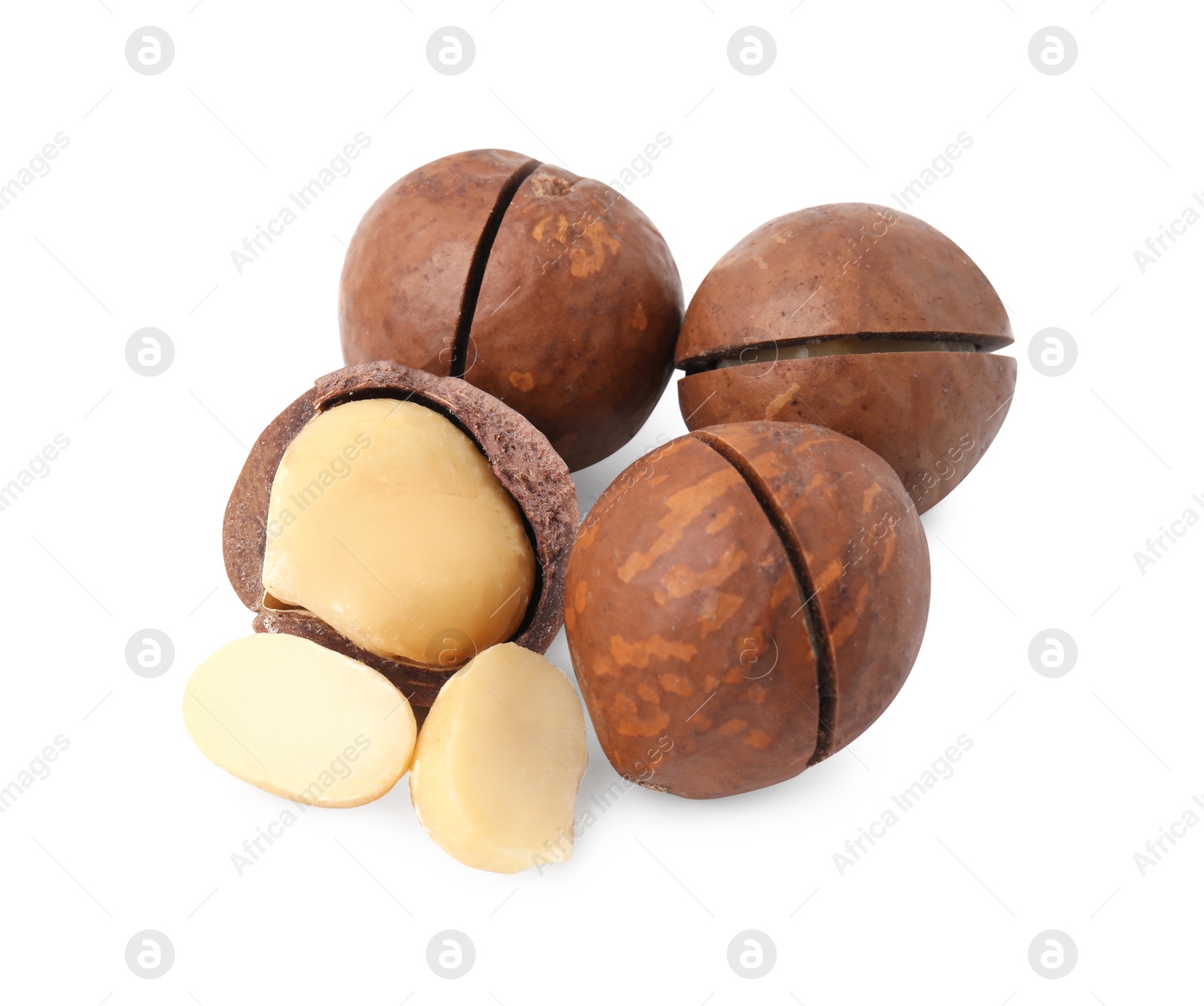 Photo of Macadamia nuts with shells isolated on white