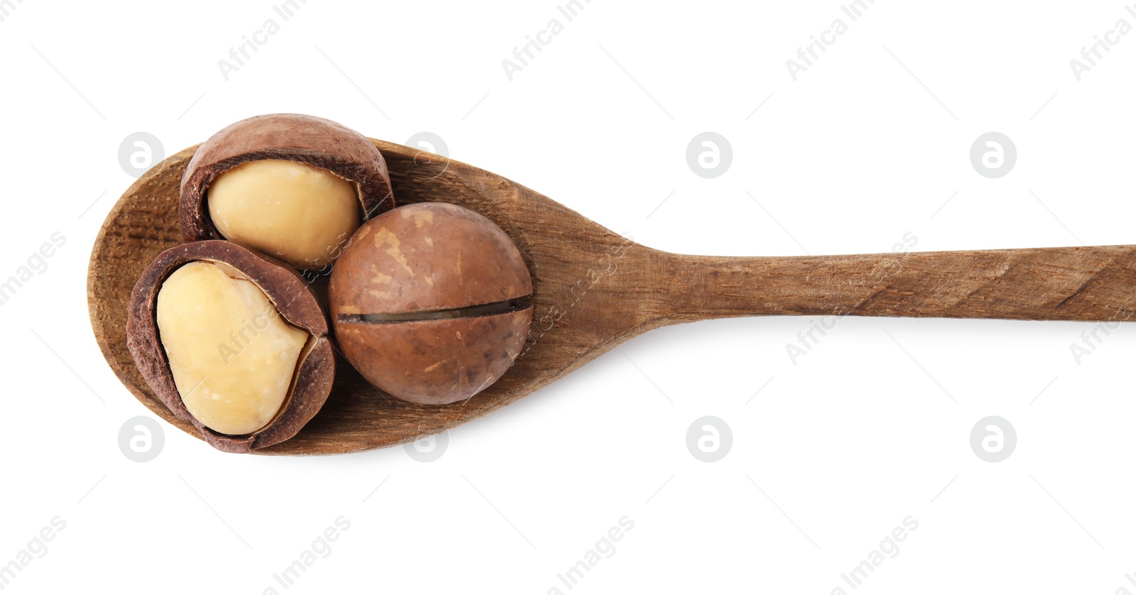 Photo of Spoon with macadamia nuts isolated on white, top view