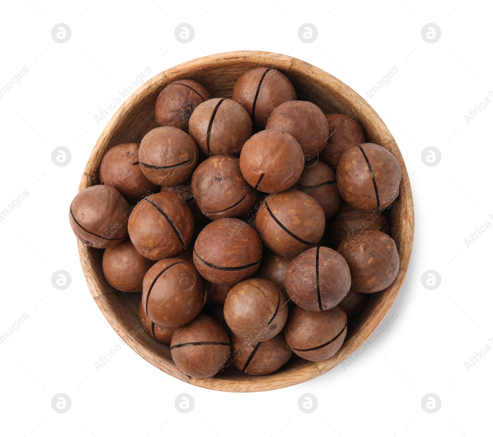 Photo of Macadamia nuts in bowl isolated on white, top view