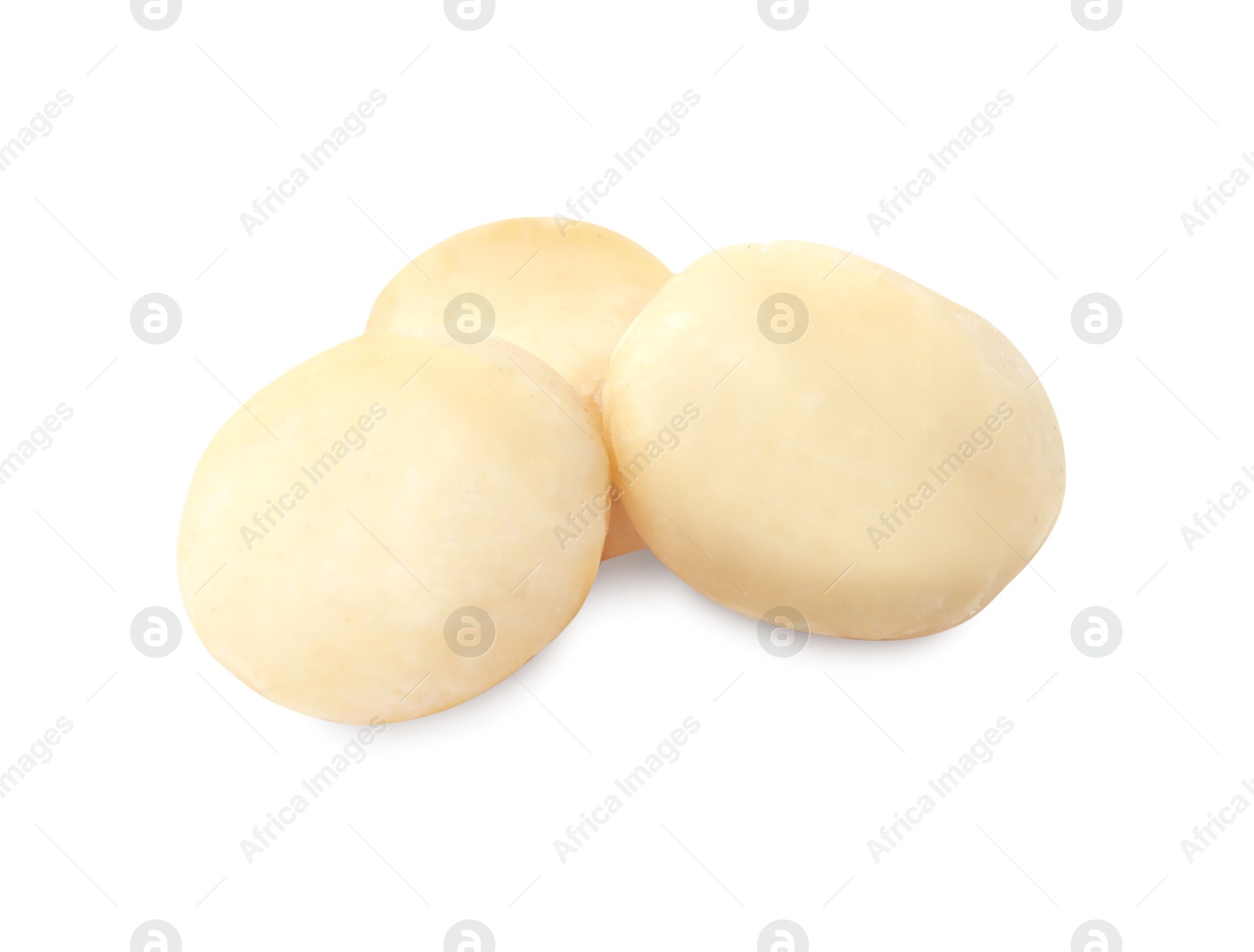 Photo of Whole peeled macadamia nuts isolated on white