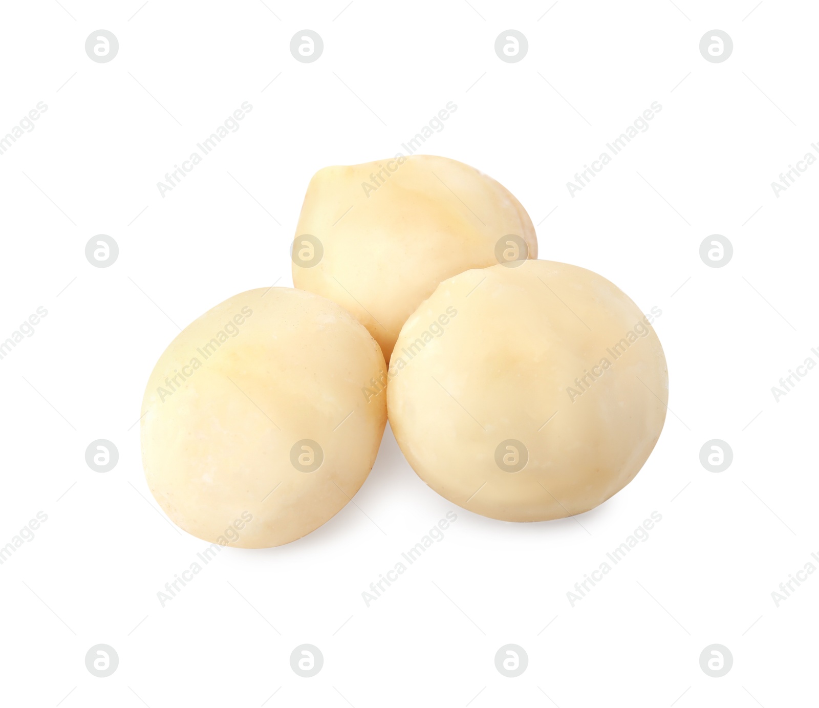 Photo of Whole peeled macadamia nuts isolated on white