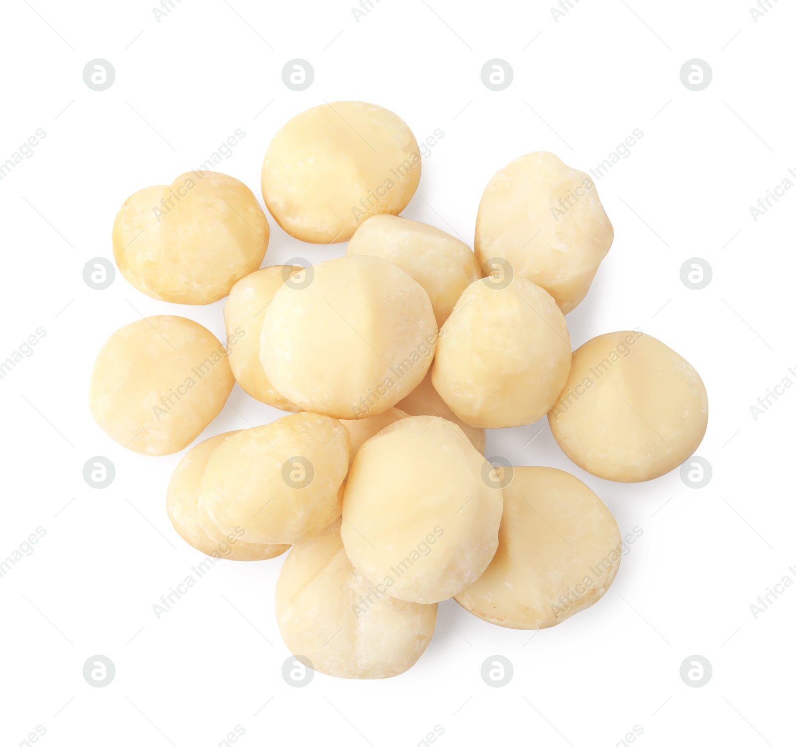 Photo of Pile of peeled macadamia nuts isolated on white, top view