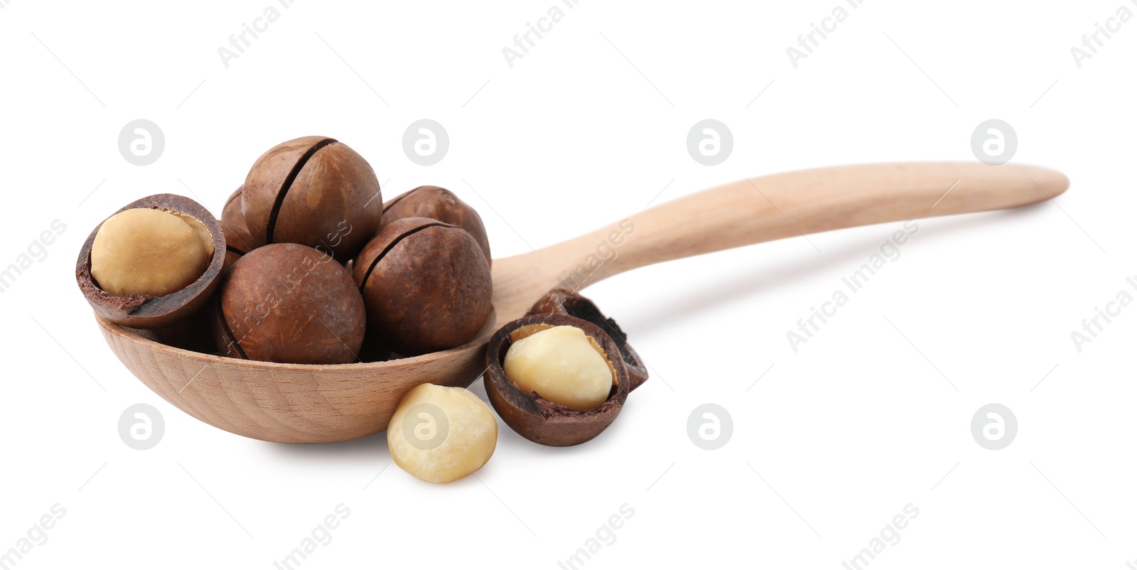 Photo of Spoon with macadamia nuts isolated on white