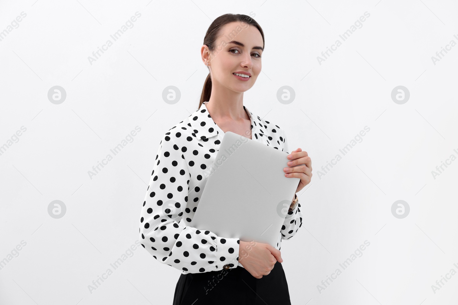 Photo of Portrait of smiling businesswoman with laptop on white background