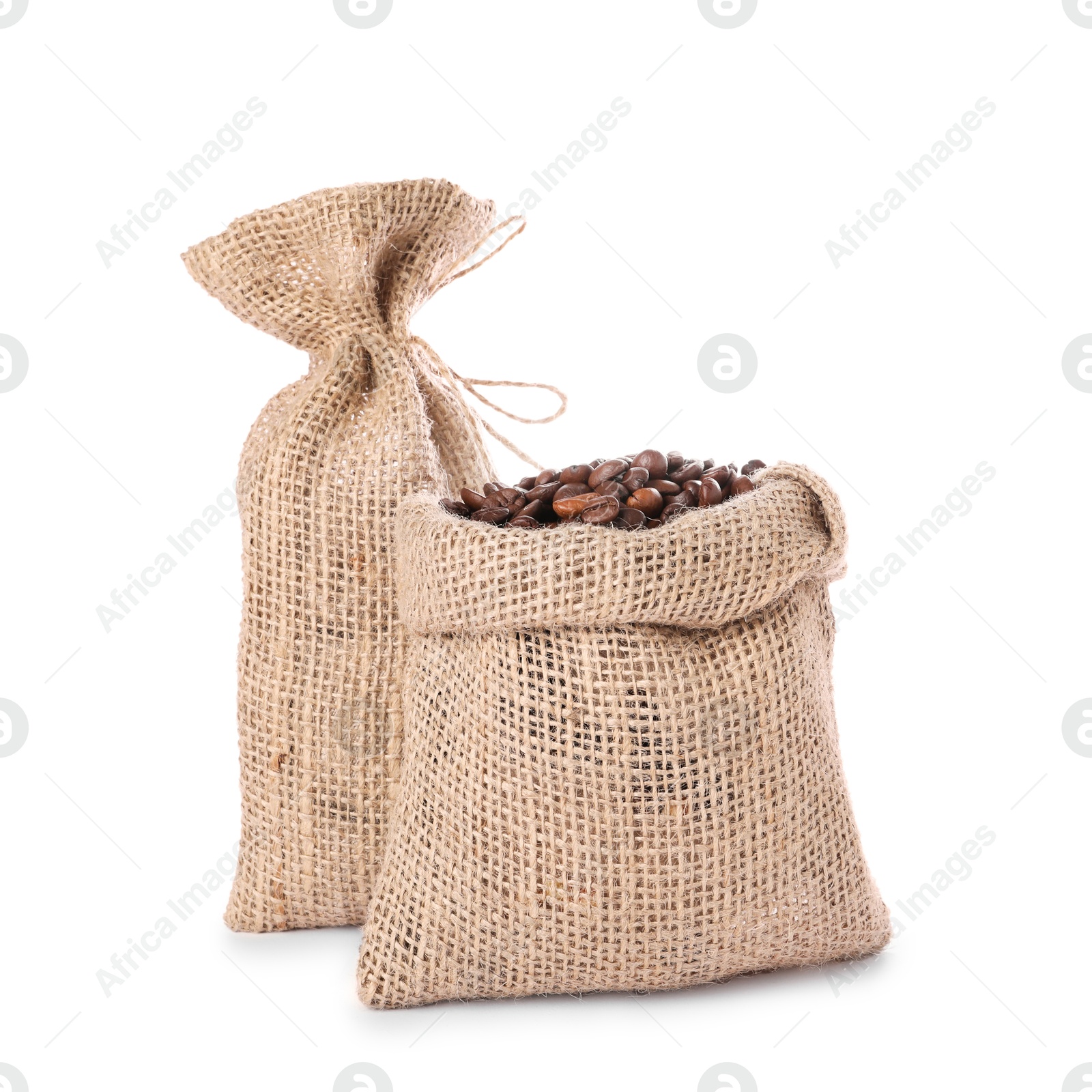 Photo of Two burlap sacks with coffee beans isolated on white