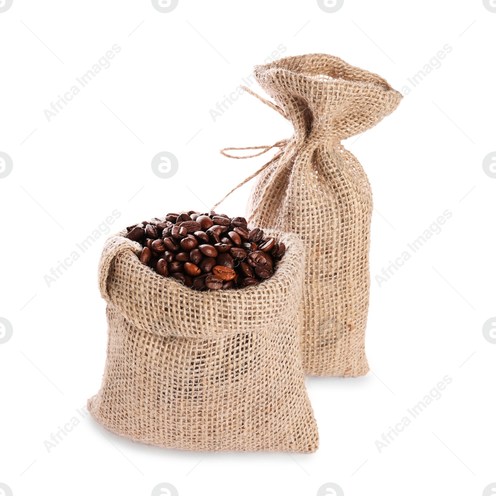 Photo of Two burlap sacks with coffee beans isolated on white