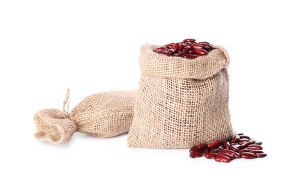 Photo of Burlap sacks with dried red beans isolated on white