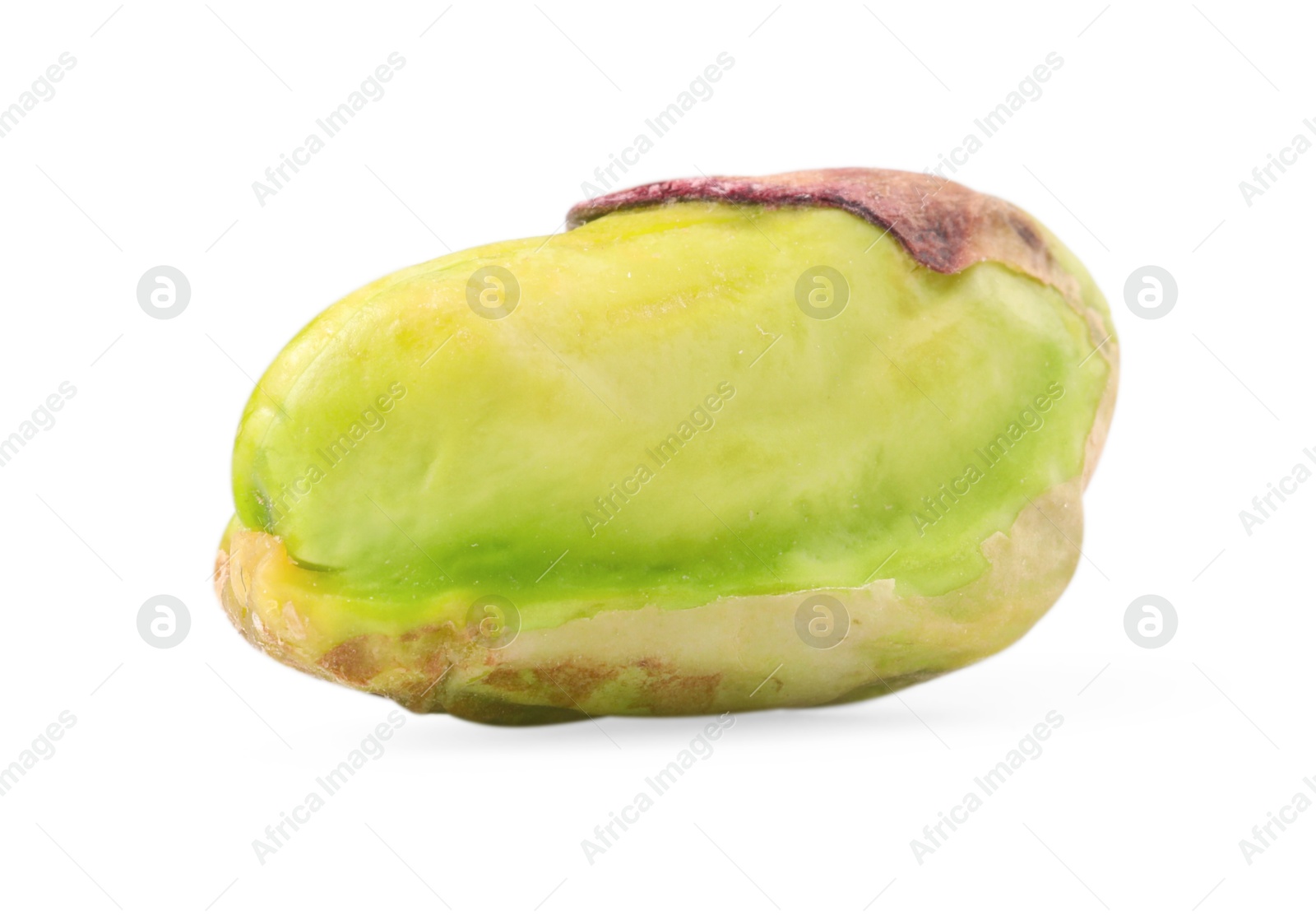 Photo of One peeled pistachio nut isolated on white