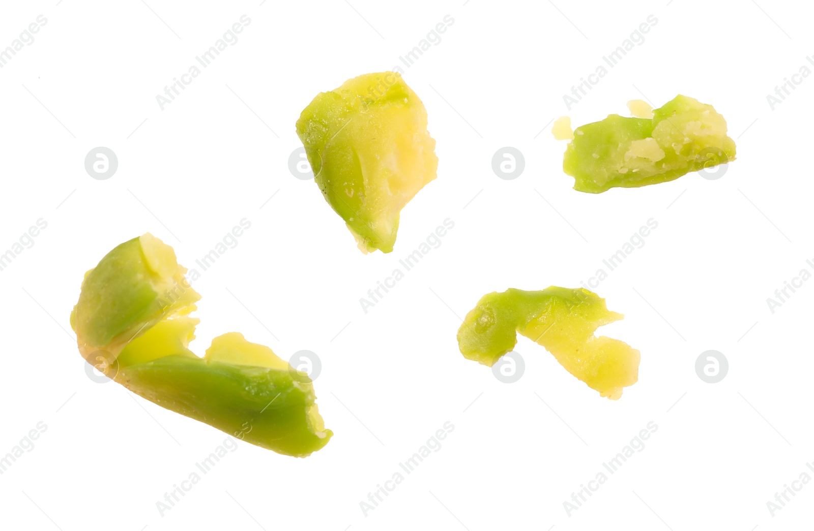 Photo of Pieces of peeled pistachio nut isolated on white