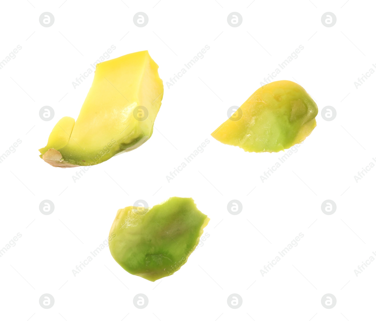 Photo of Pieces of peeled pistachio nut isolated on white