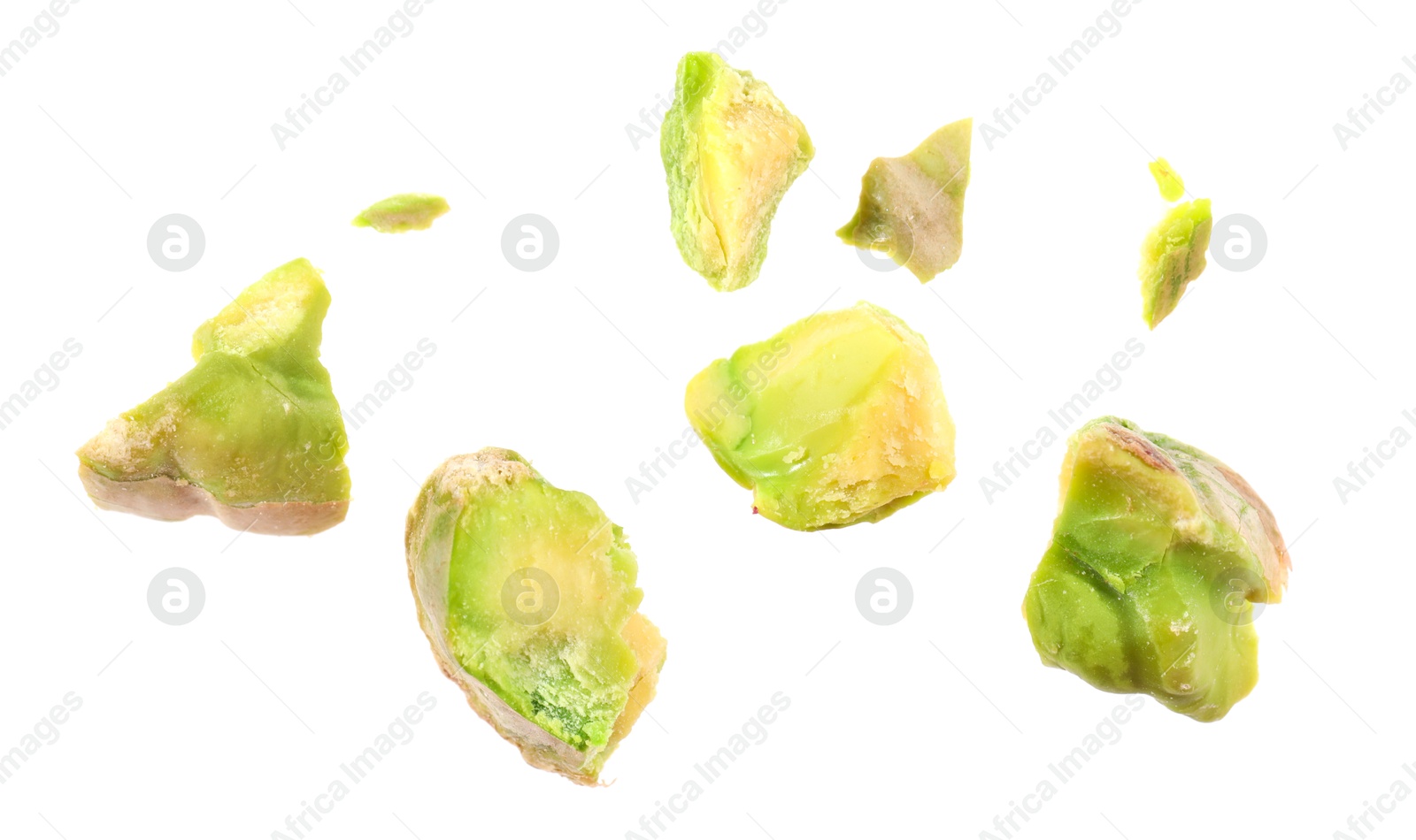 Photo of Pieces of peeled pistachio nut isolated on white