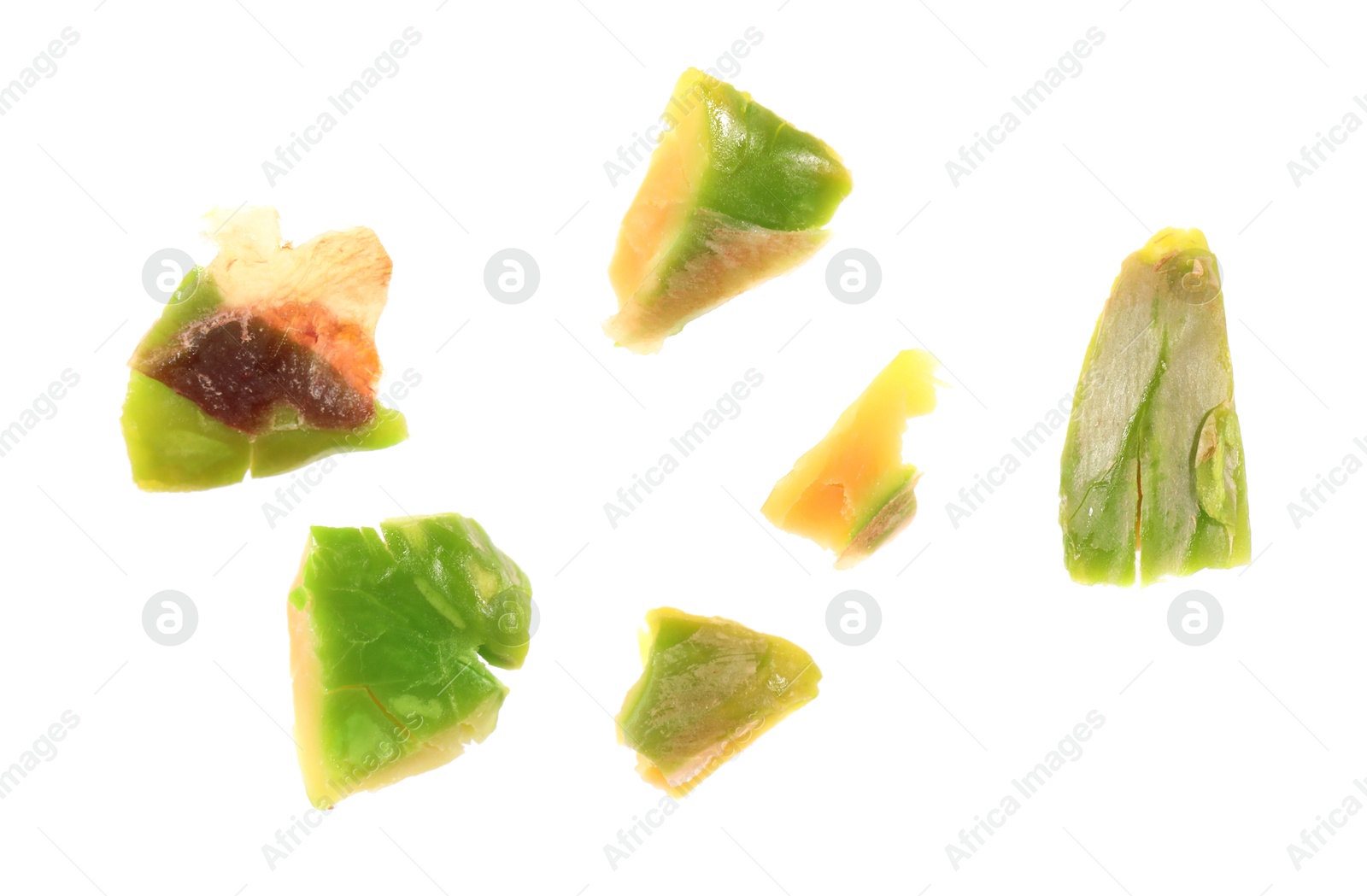 Photo of Pieces of peeled pistachio nut isolated on white