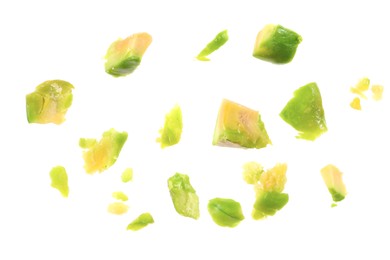 Photo of Pieces of peeled pistachio nut isolated on white