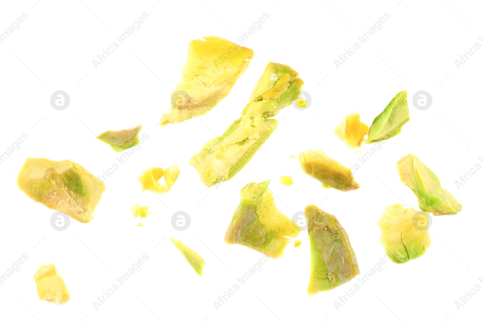 Photo of Pieces of peeled pistachio nut isolated on white