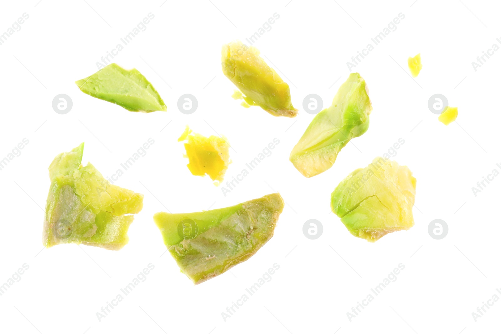 Photo of Pieces of peeled pistachio nut isolated on white