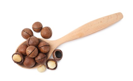 Photo of Spoon with macadamia nuts isolated on white, top view