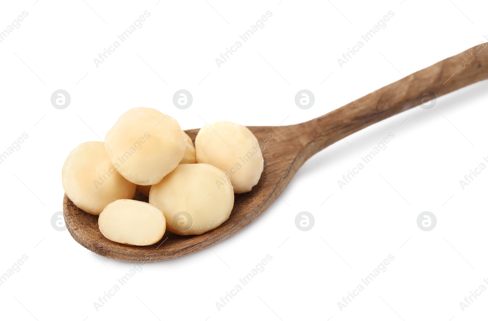 Photo of Spoon with macadamia nuts isolated on white