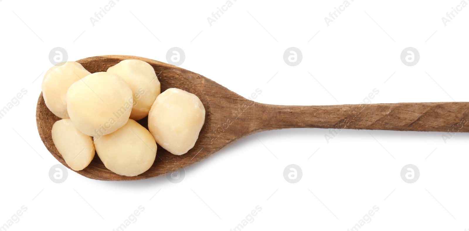 Photo of Spoon with macadamia nuts isolated on white, top view