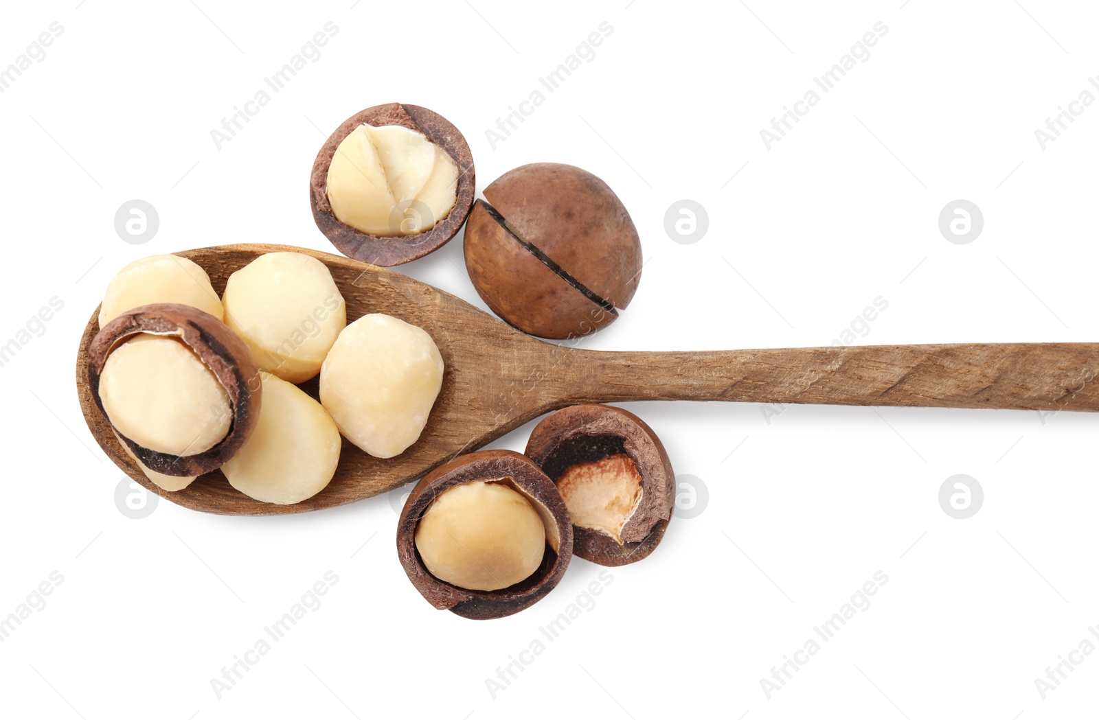 Photo of Spoon with macadamia nuts isolated on white, top view