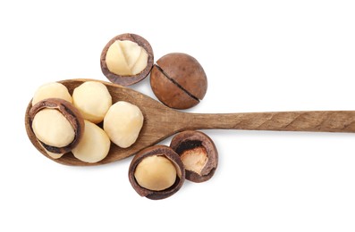 Spoon with macadamia nuts isolated on white, top view