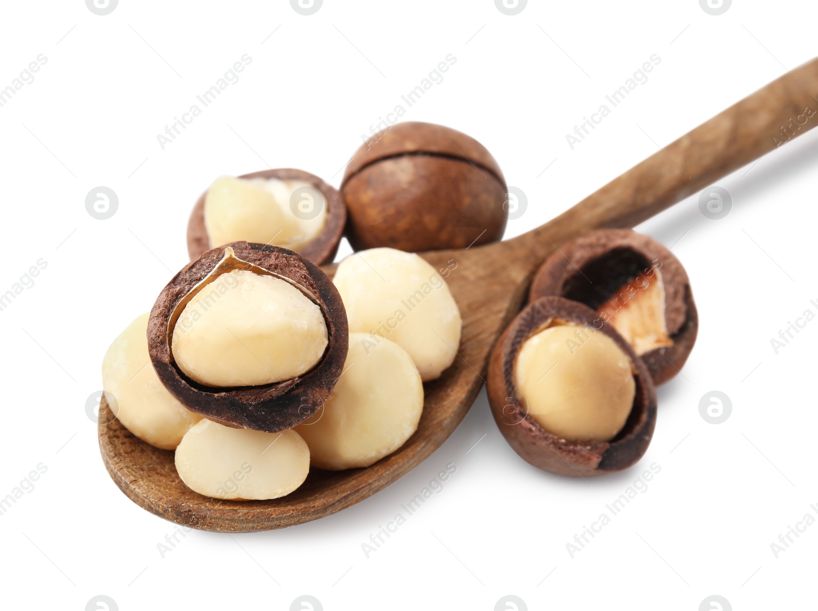 Photo of Spoon with macadamia nuts isolated on white