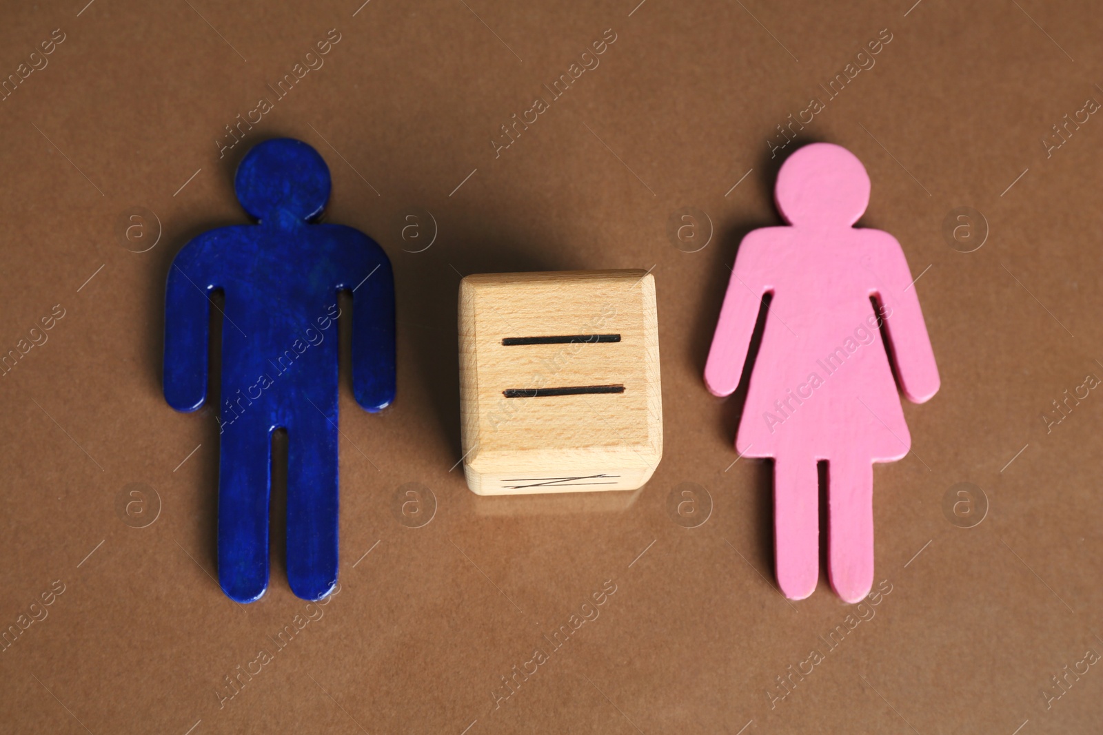 Photo of Gender equality concept. Male and female figures on brown background, above view