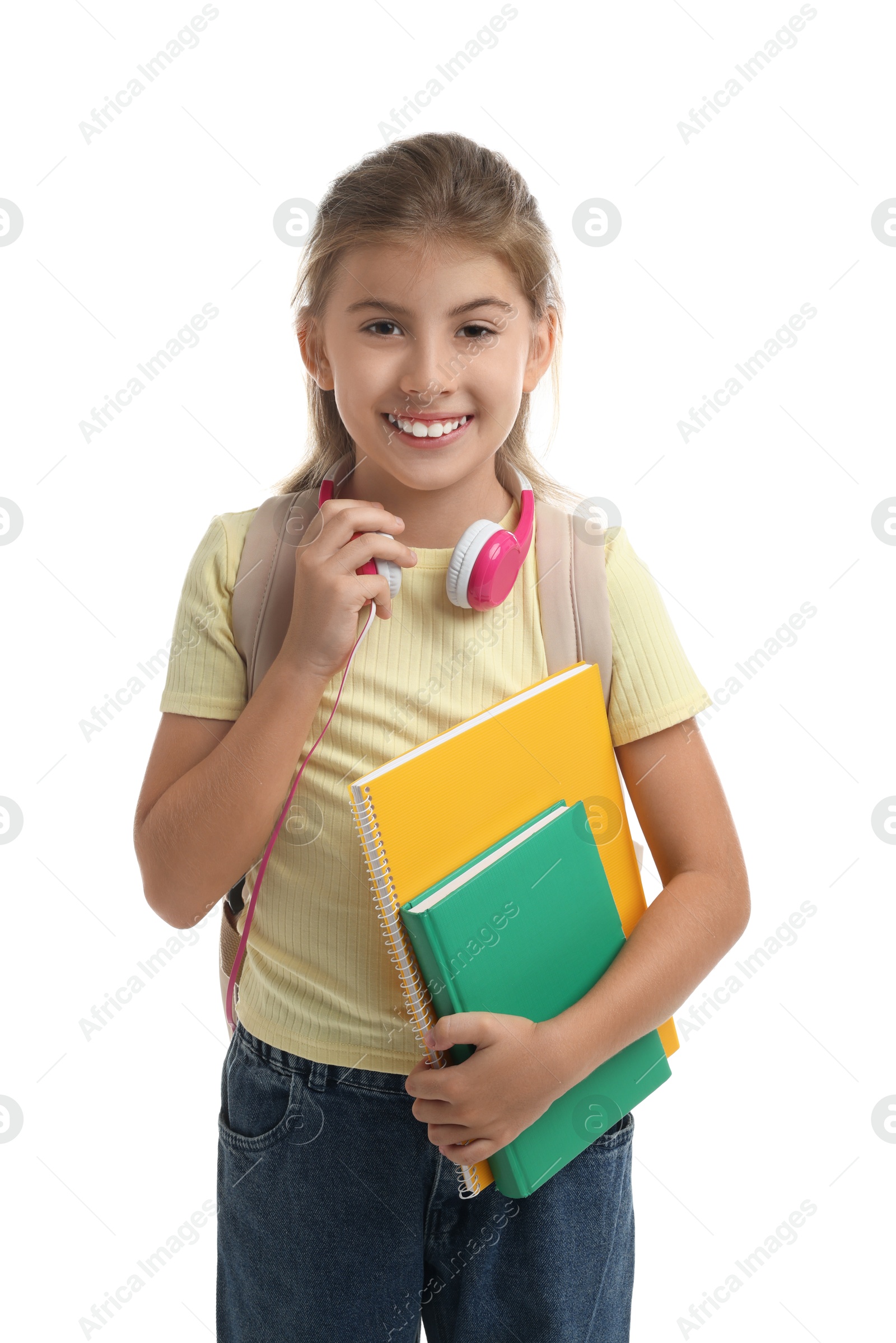 Photo of Portrait of girl with backpack and books on white background