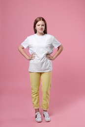 Photo of Portrait of teenage girl on pink background