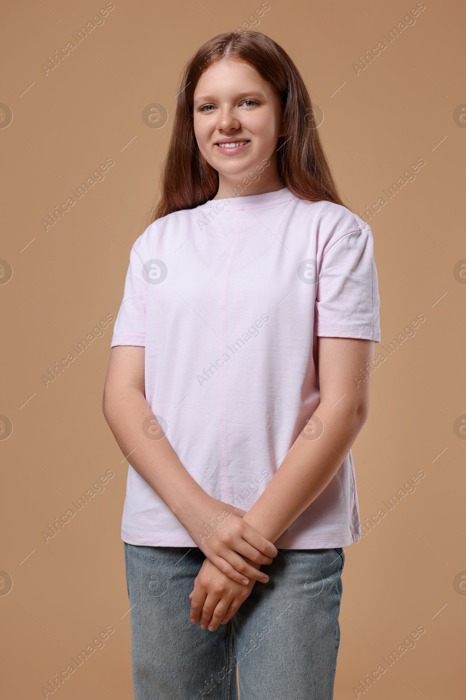 Photo of Portrait of teenage girl on beige background