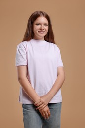 Photo of Portrait of teenage girl on beige background