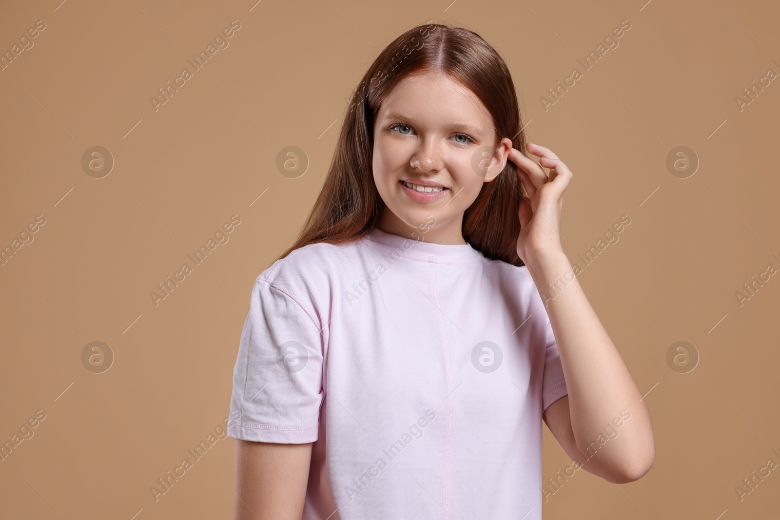 Photo of Portrait of teenage girl on beige background