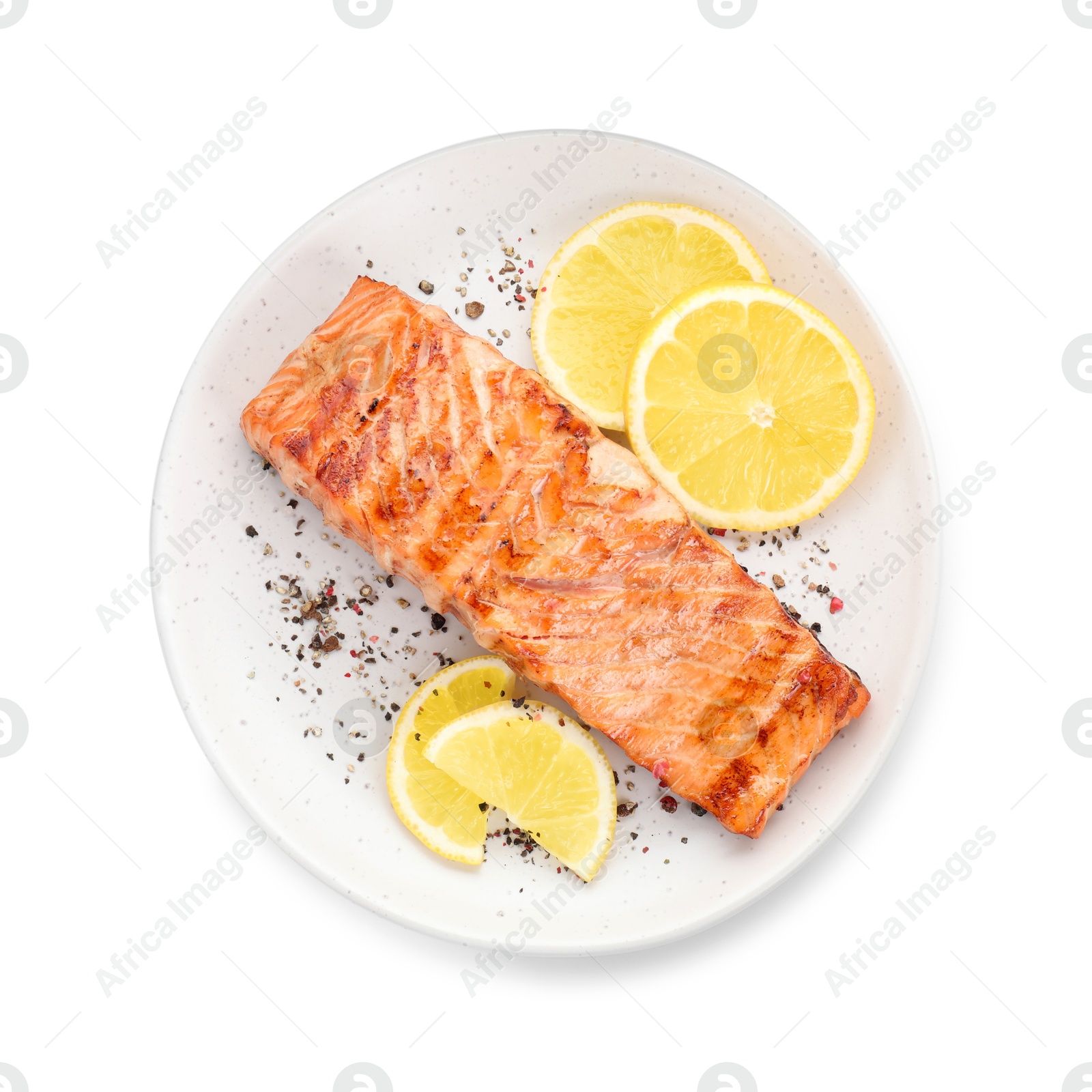 Photo of Delicious grilled salmon fillet with lemon slices and spices isolated on white, top view