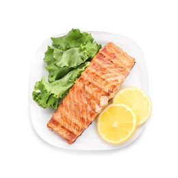 Photo of Delicious grilled salmon fillet with lemon slices and lettuce isolated on white, top view