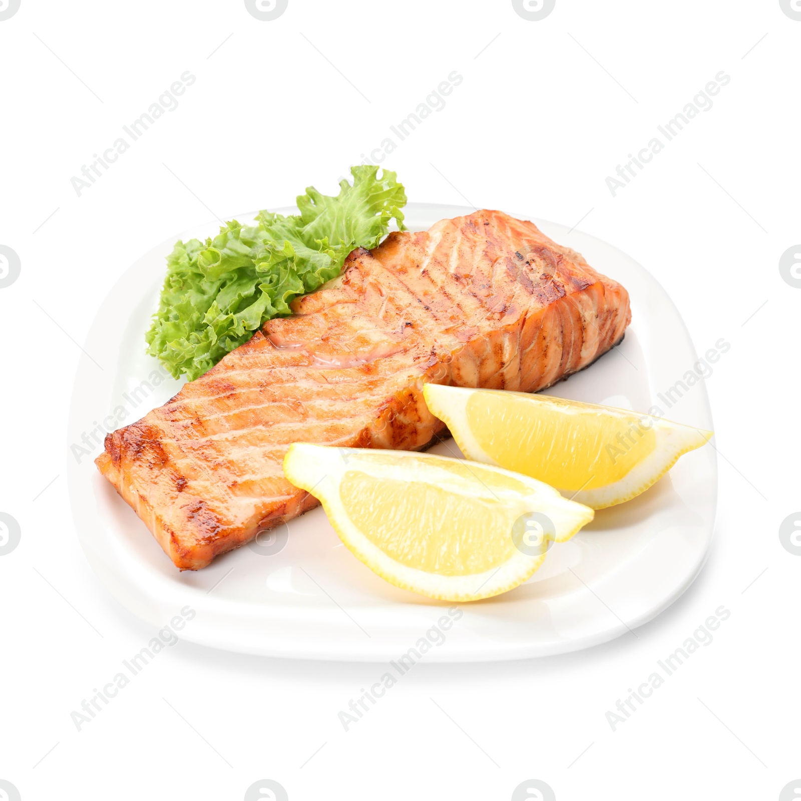 Photo of Delicious grilled salmon fillet with lemon and lettuce isolated on white